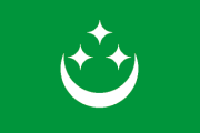 green, white crescent and three white stars